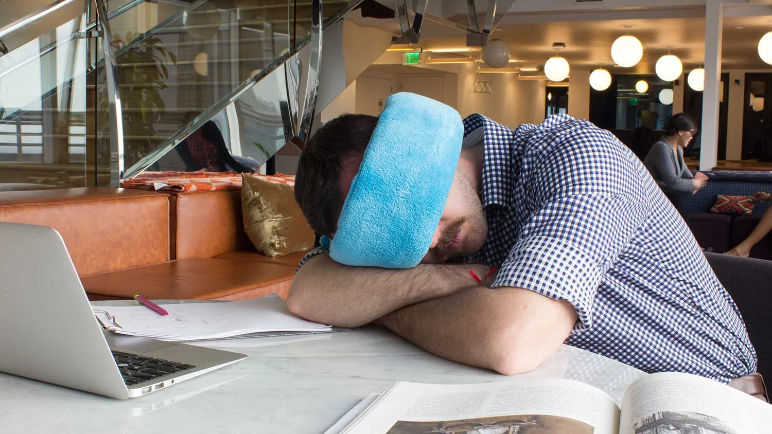 Office worker napping with the Wrap-a-Nap